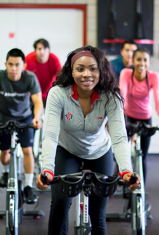 Students ride exercise bikes at the ARC