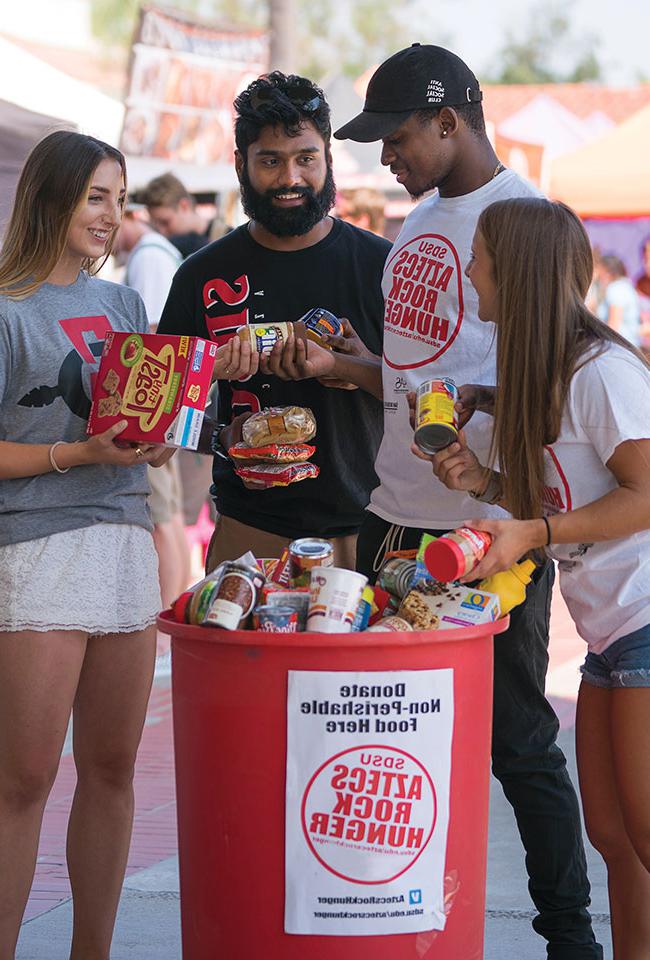 Students donate food for the Aztecs Rock Hunger food drive