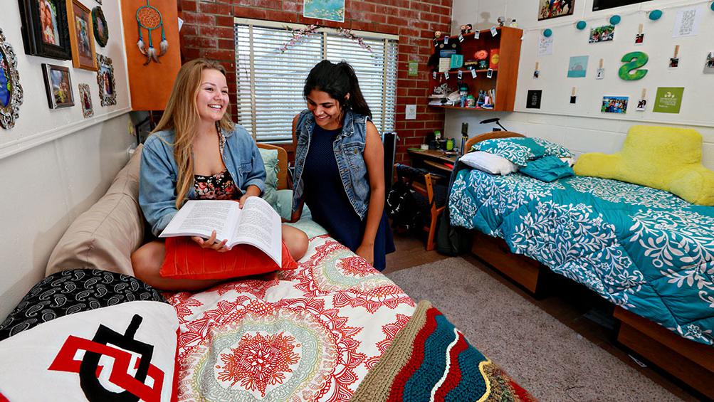 Two students in a dorm room